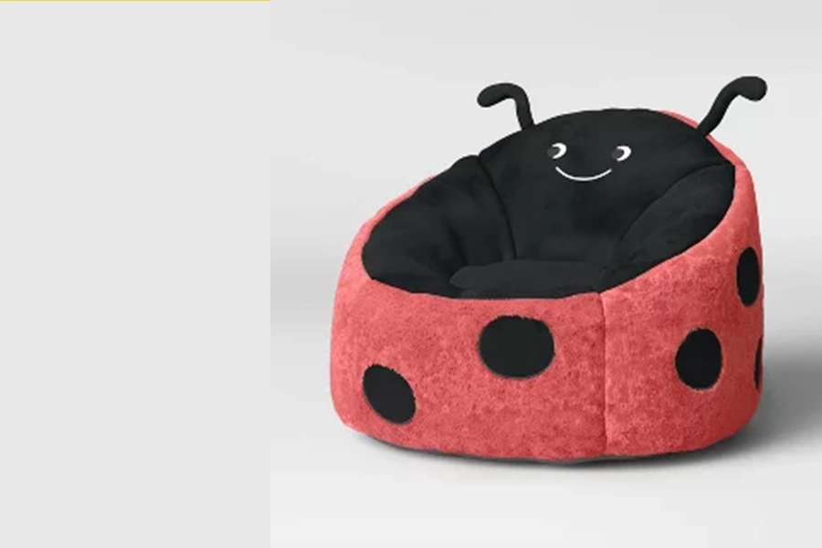 Red and black ladybug-shaped kids’ bean bag chair