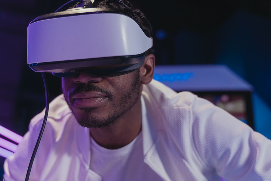 A man wearing AR glasses in an arcade