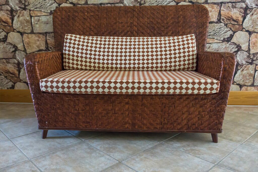 Chocolate-brown sofa standing out perfectly on a tiled floor