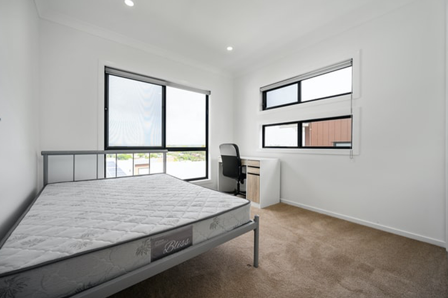 A mattress placed on top of a bed frame