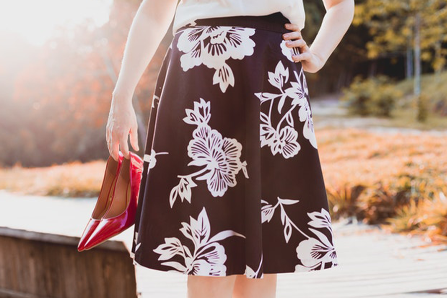 Woman wearing a black A-line skirt