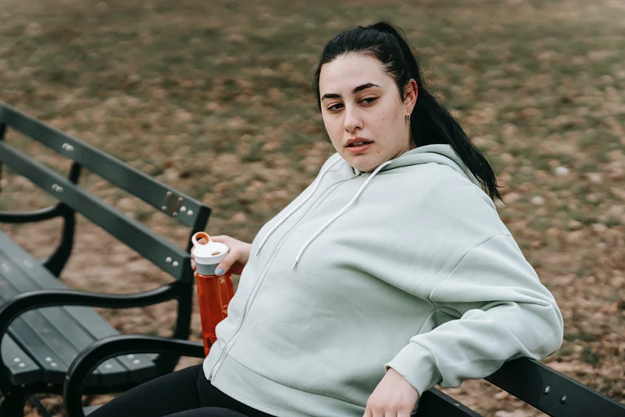 Woman wearing hoodie jacket with utility