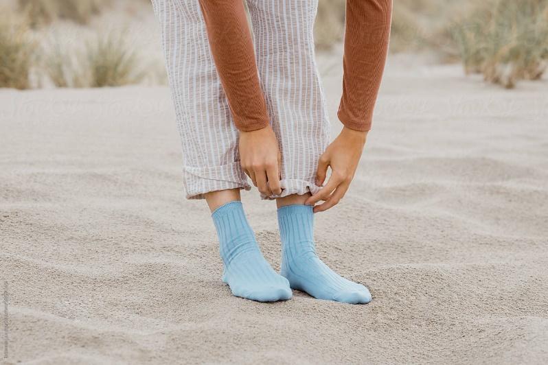 Woman wearing light blue tube socks