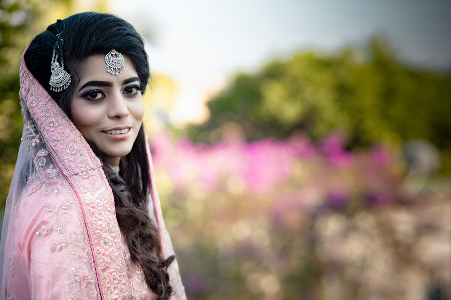 Indian lady wearing a sari and veil with embroidery trims