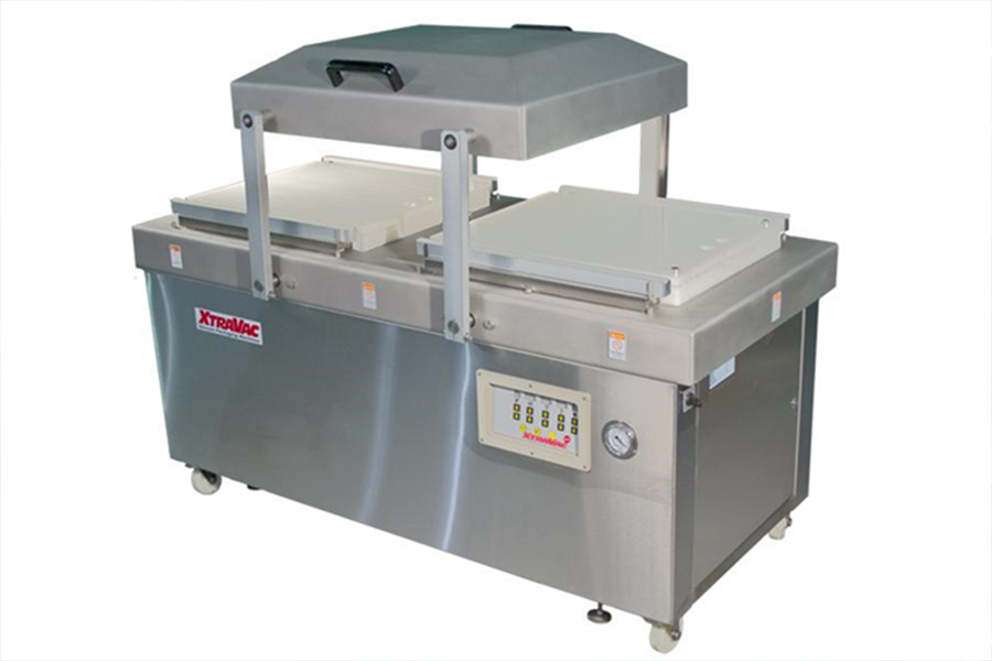 A double chamber vacuum packaging machine