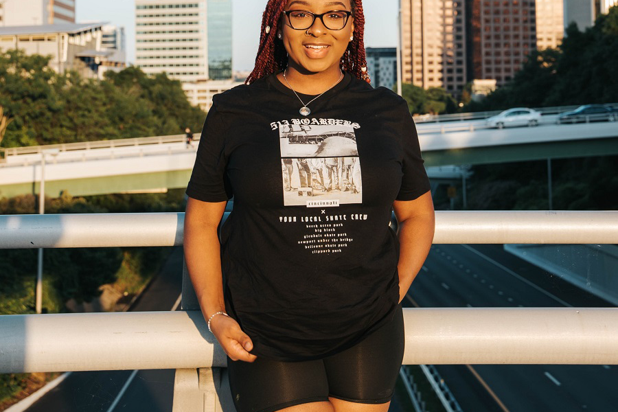 Cute smiling lady rocking black plus-size biker shorts