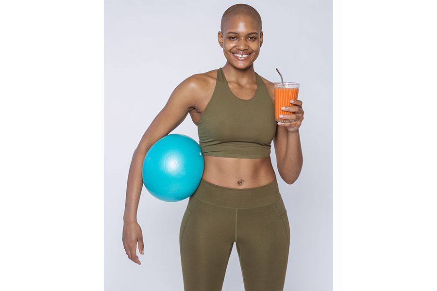 A woman wearing an olive color sports bra