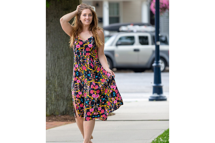 A woman wearing a multi-colored dress