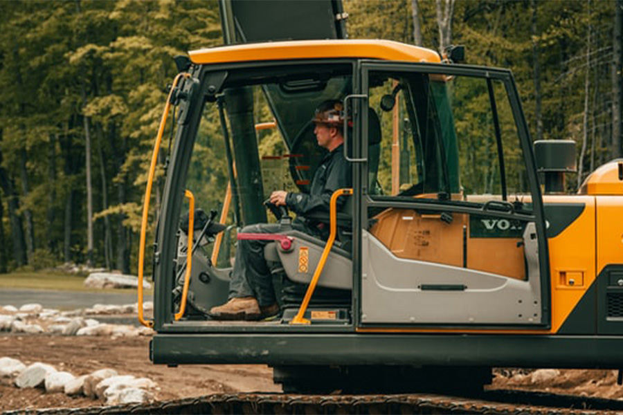 Excavator Main Cab With Operator At The Controls