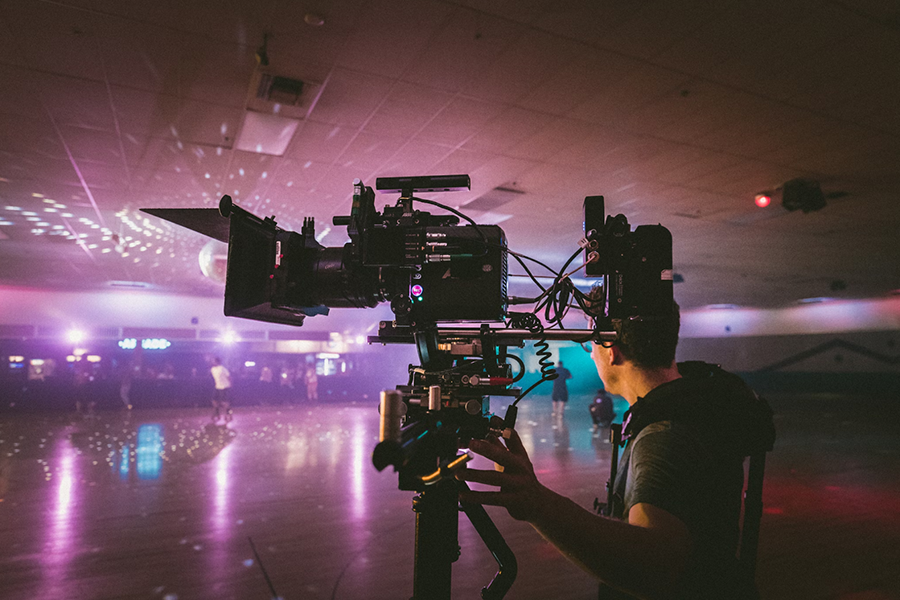 man using a camera for filming