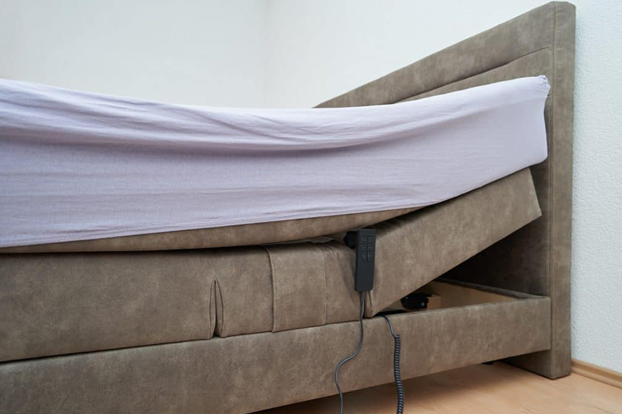 Mattress being raised by an electronic device attached to bed