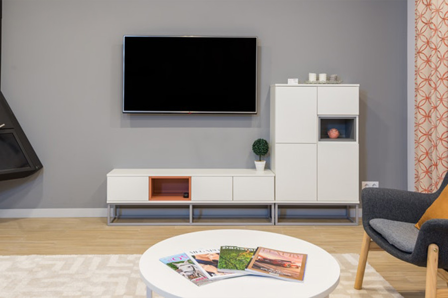 minimalist white tv stand with a tv above