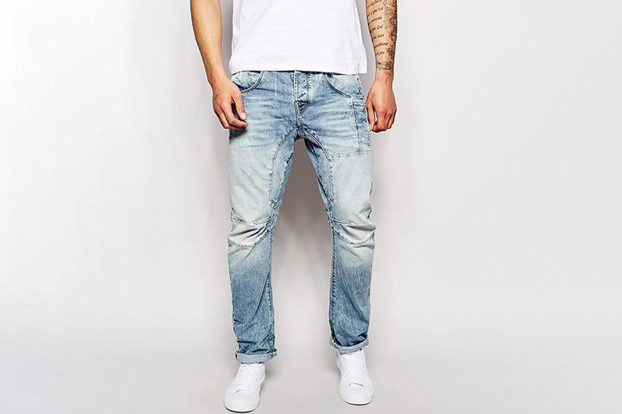 A man rocking bright blue twisted seam denim trousers