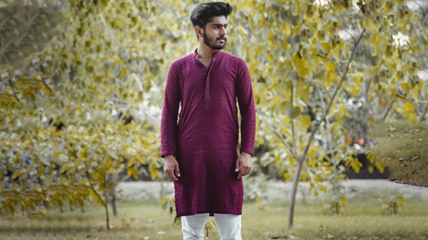 A Man Wearing Red Kurtas With White Pants