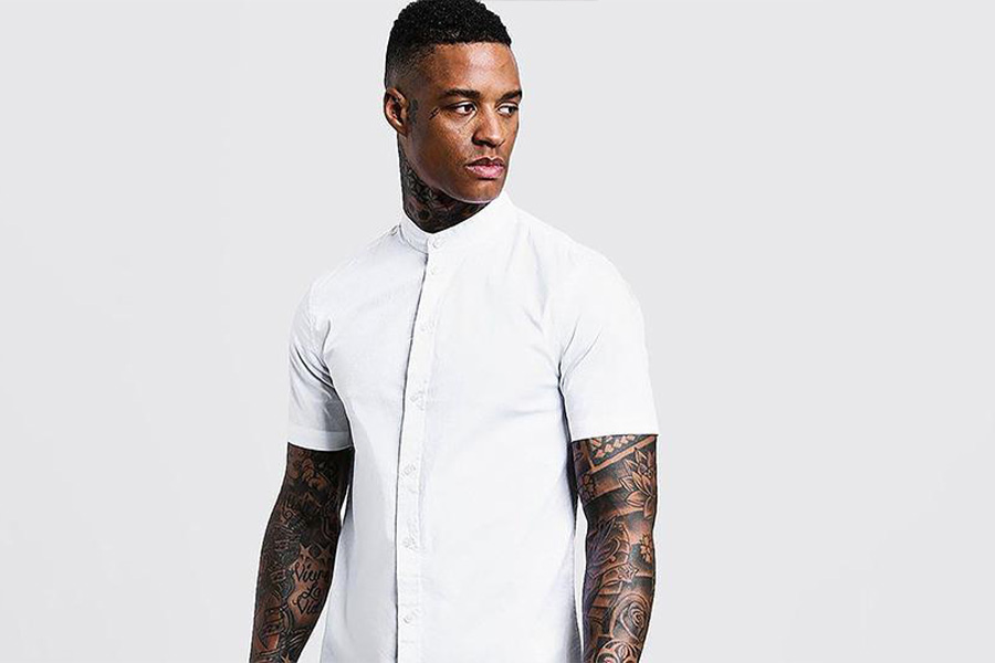 A man wearing white band collar shirt