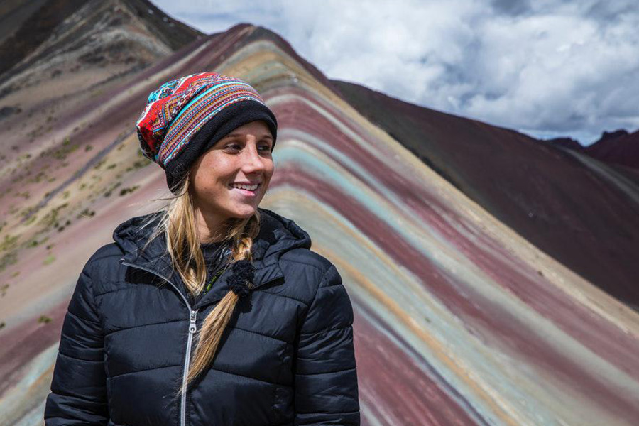 Beautiful lady wearing black padded outwear and a hat