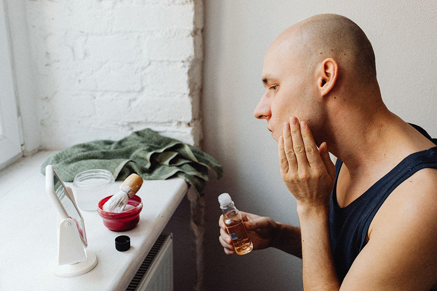 Man applying toner after shaving