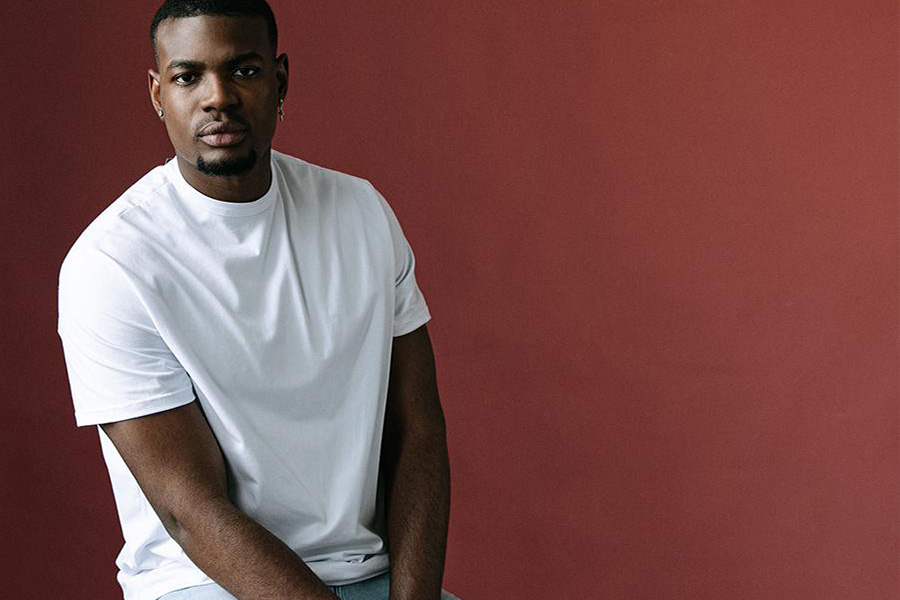 Man rocking white t-shirt over light blue denim pants