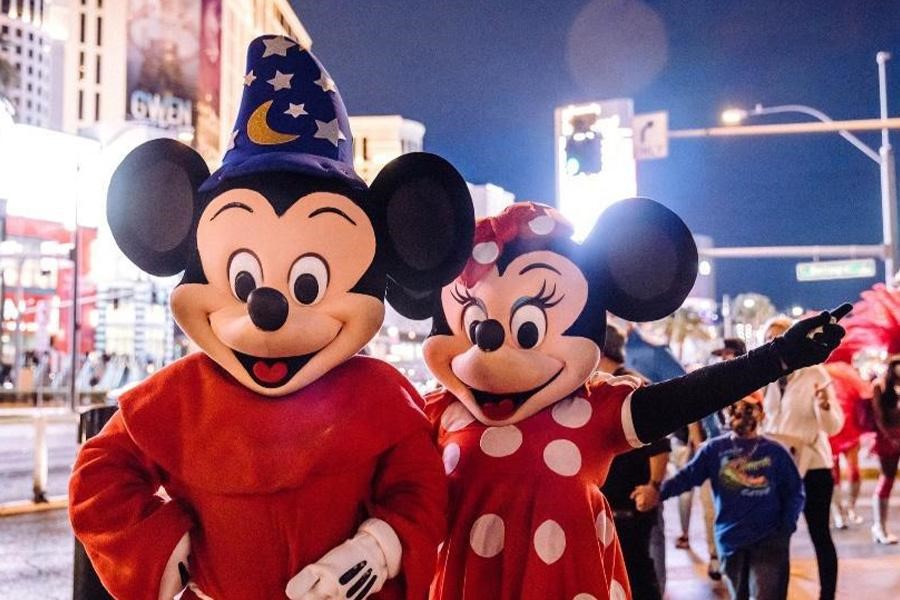 People dressed up as Mickey Mouse and Minnie Mouse