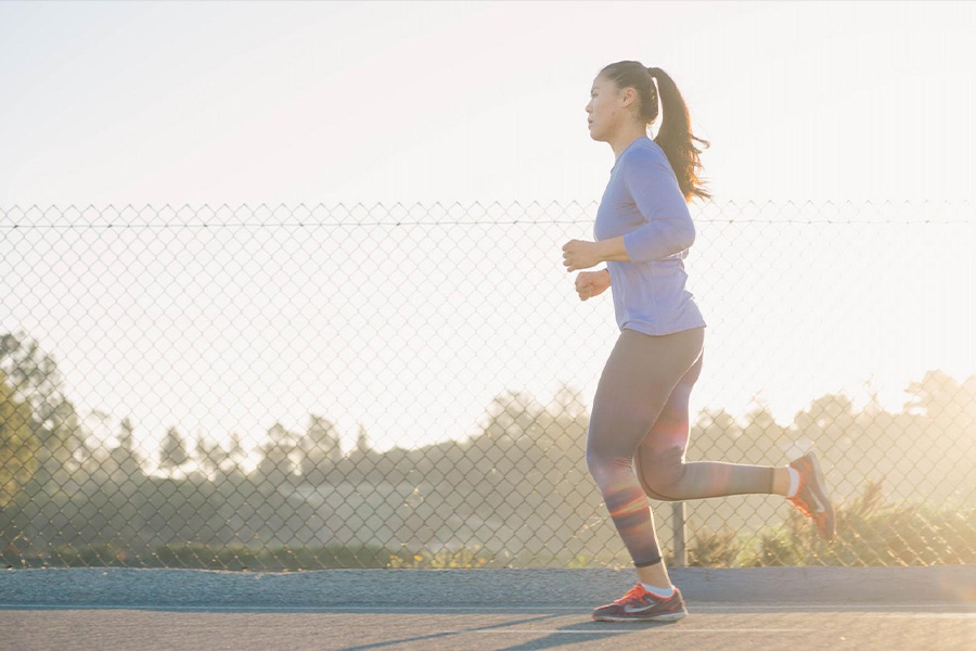 Person running outside on the road