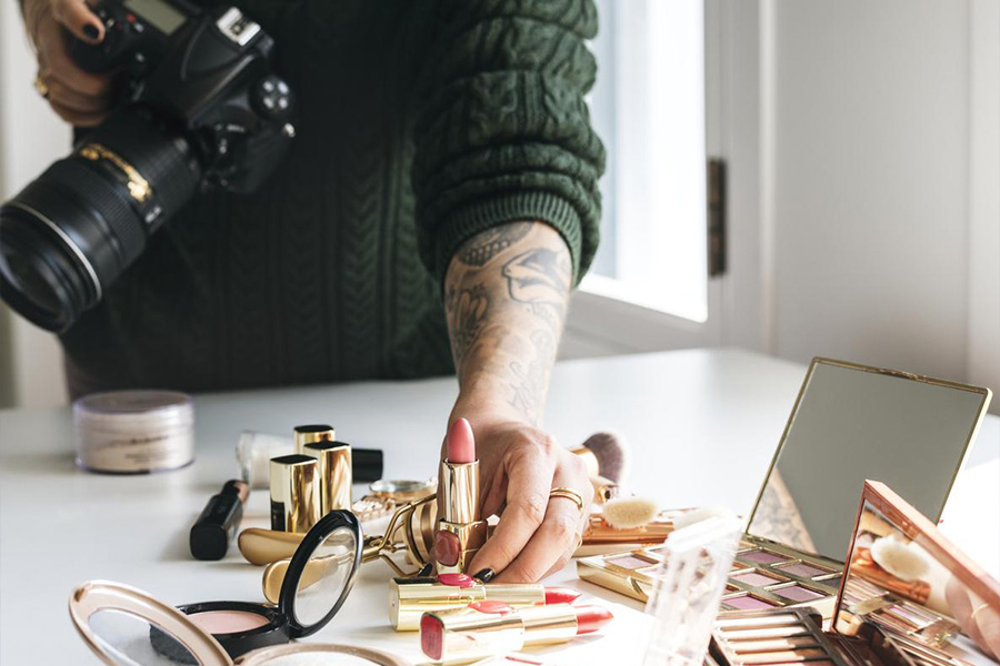 Photographer taking picture of a make-up set