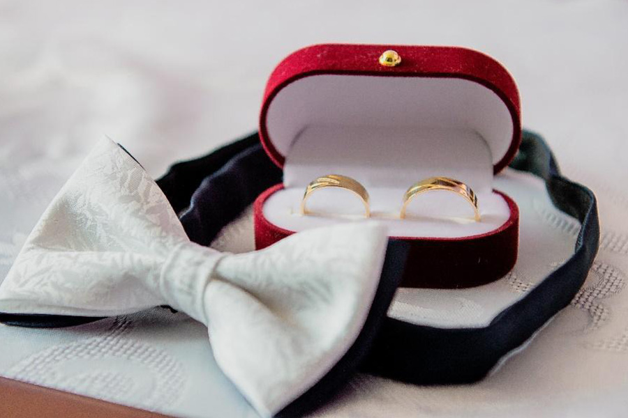 Red velvet hinged ring box with double ring design