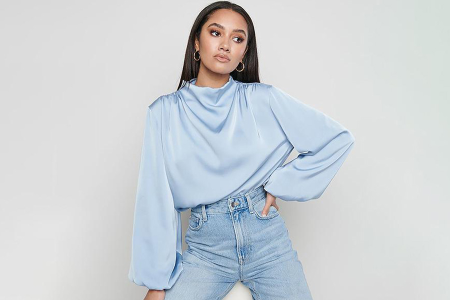 A woman in a light blue voluminous top