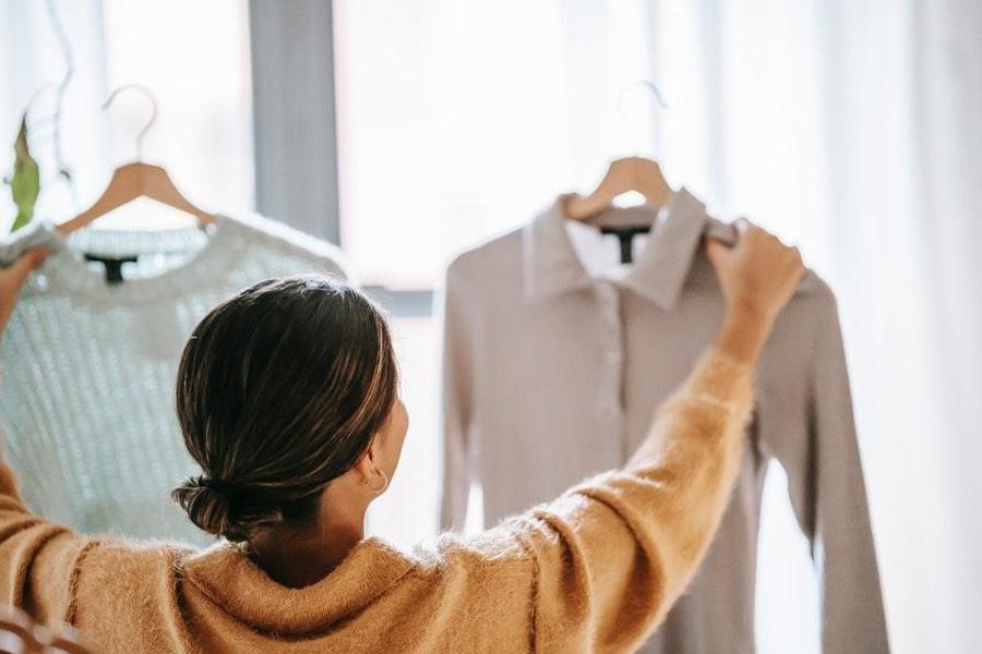 Woman in brown shirt trying to make a decision