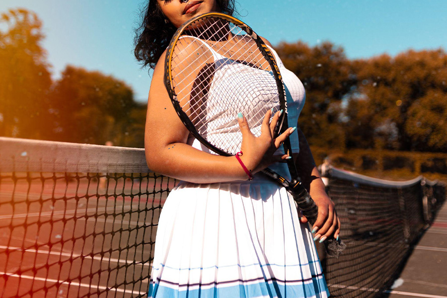 Woman playing tennis in skorts