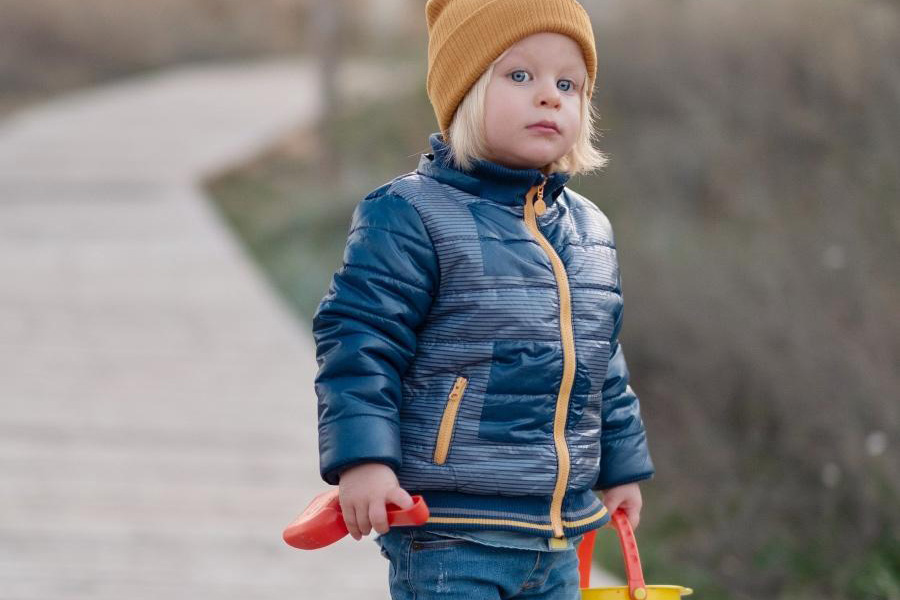 Boy in a red insulated down coat