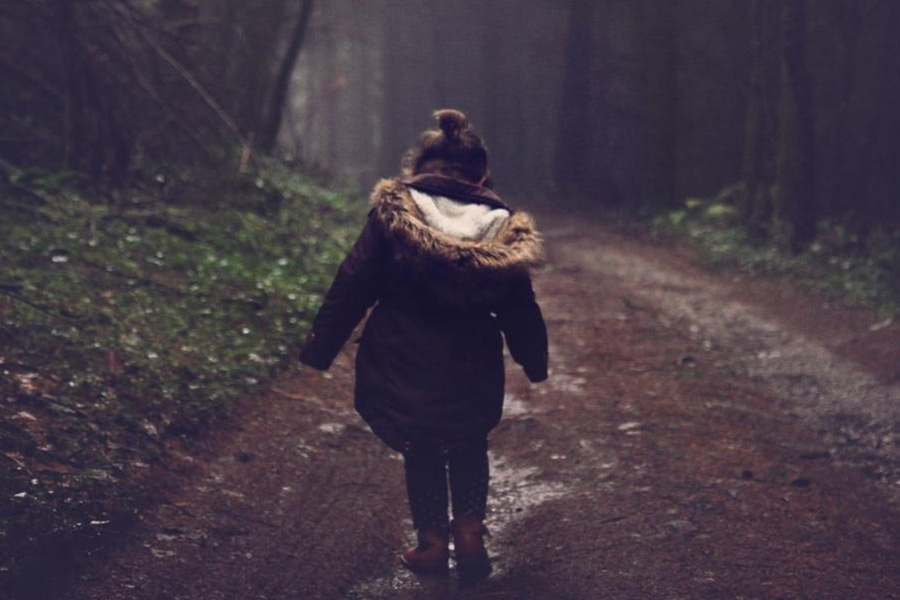 Girl in a brown earth-tone shearling coat