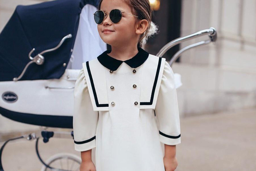 Girl in a white and black collar dress