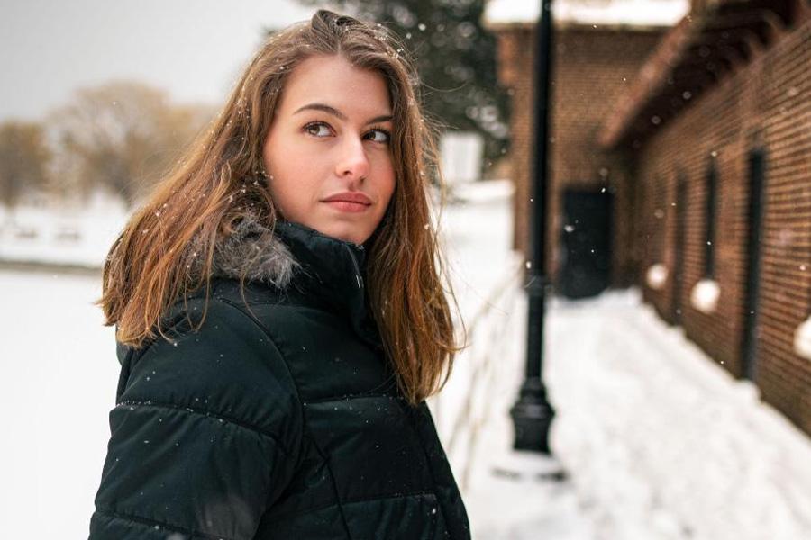 Lady in a black quilted puffer jacket