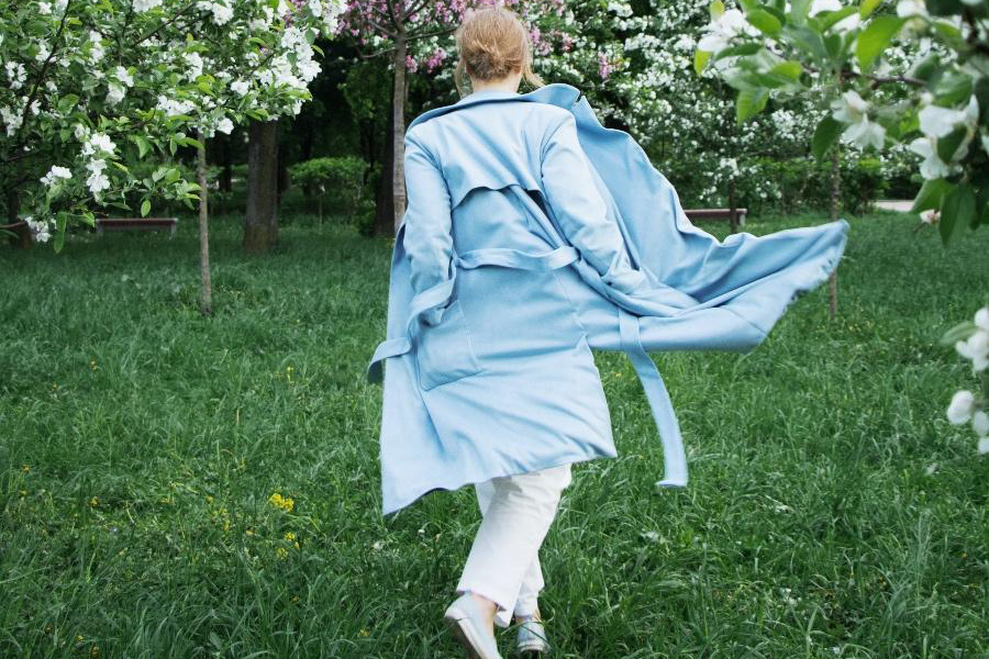 Lady wearing a blue-colored trench coat