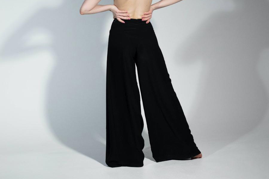 Lady wearing black wide-leg trousers