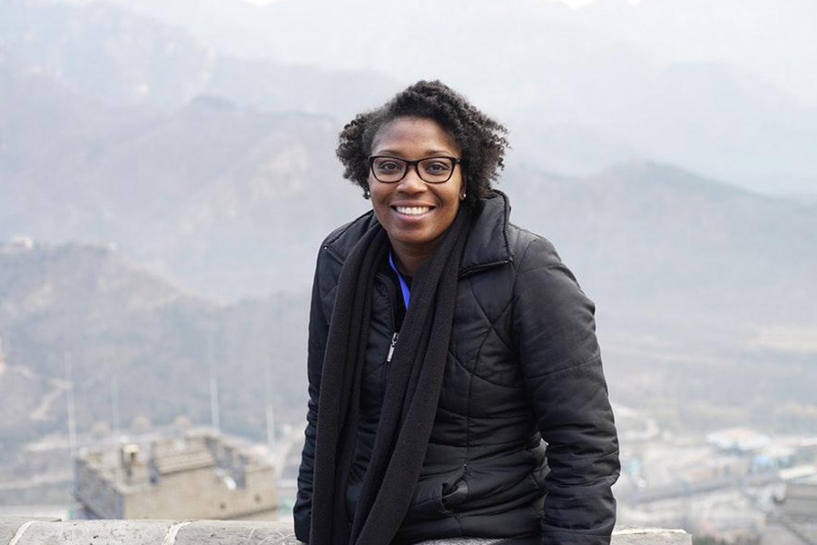 Lady with glasses wearing a black puffer jacket