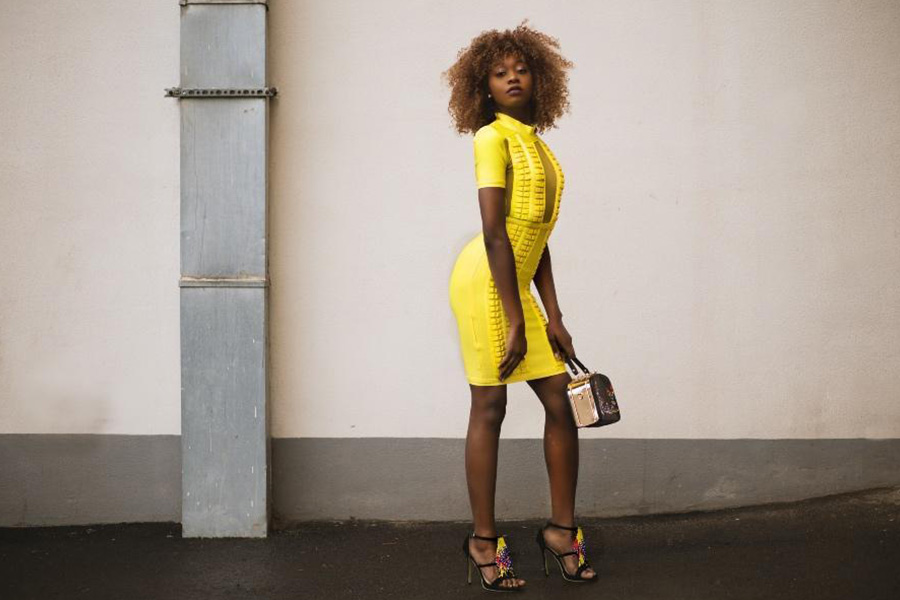 Woman wearing a bright yellow knitted dress