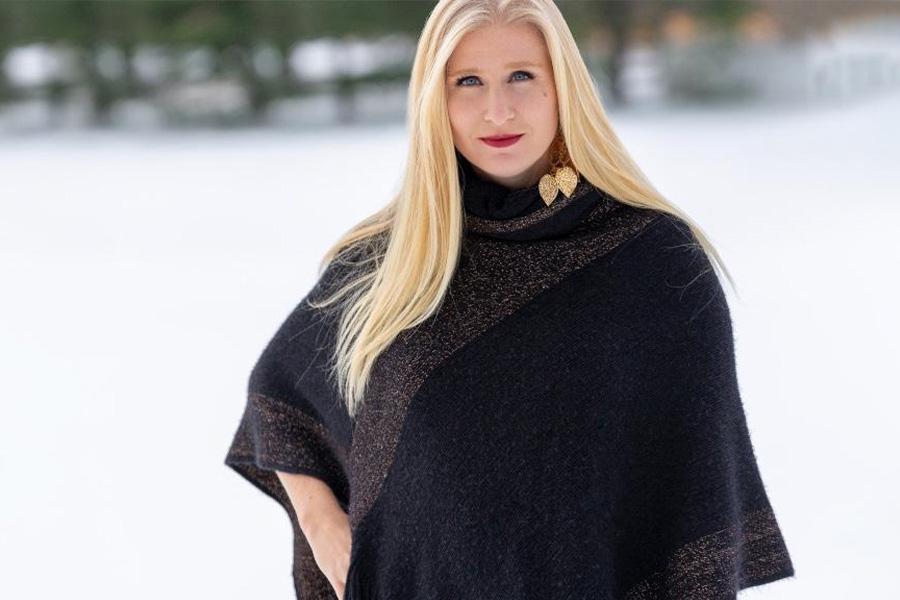 Woman wearing a deep-blue poncho