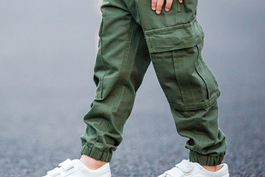 Anonymous kid posing with green cargo pants