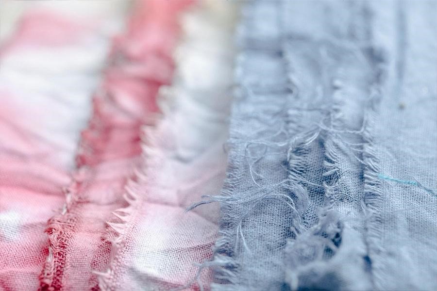 Blue and pink organic fabrics on a table