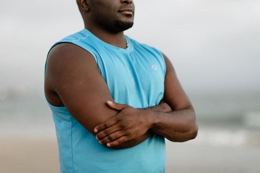 Man donning a blue tank top