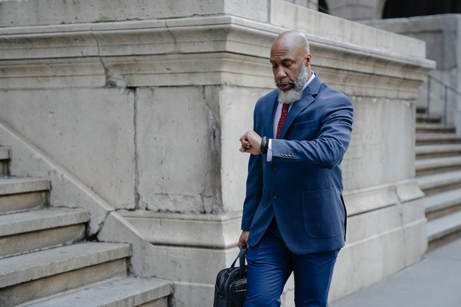 Man wearing a blue suit and red tie