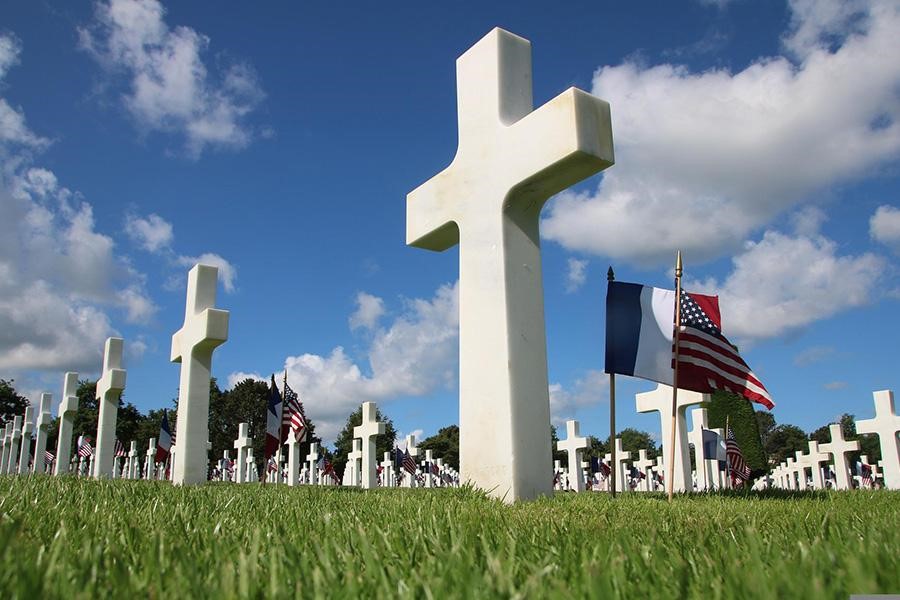 Numerous headstones in a cemetery