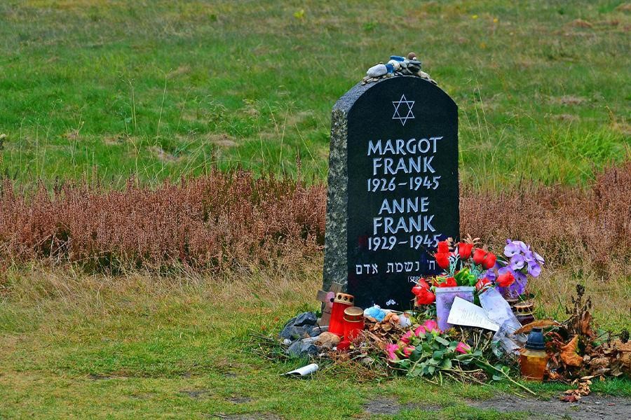 Slate headstone with numerous flowers