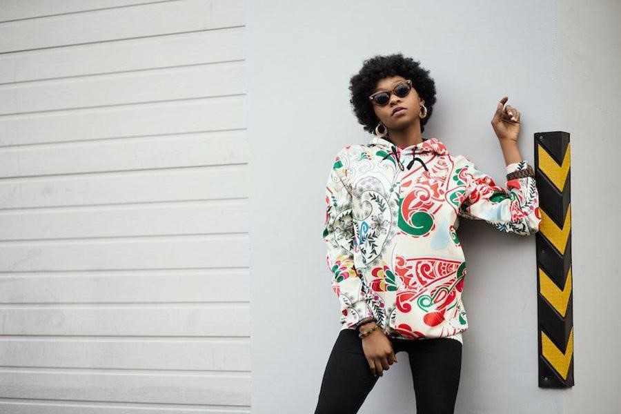 Woman rocking a red and white floral hoodie jacket