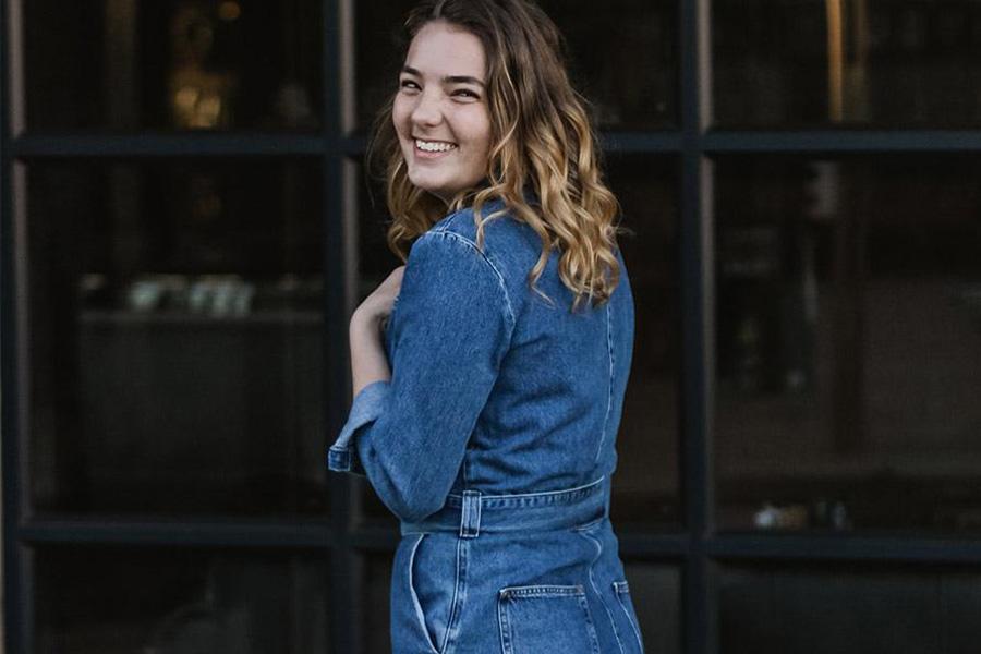 Woman wearing a blue denim boilersuit