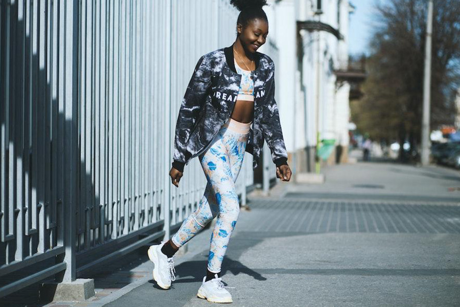 Woman wearing a jacket over a supportive crop top