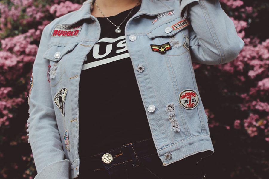 Woman wearing outfit with decorative buttons and branded trims