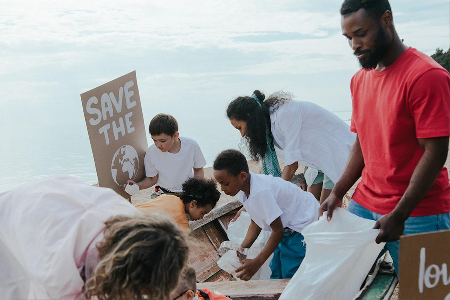 A group of people cleaning the beach