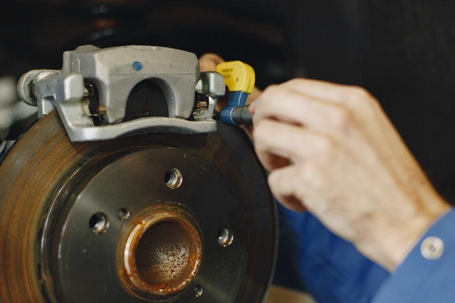 Man checking the level of retaining clips